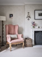 Classic pink armchair in classic bedroom