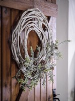 Detail of twig wreath on bedroom door 