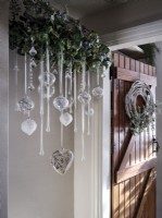 Detail of hanging glass bauble and twig wreath