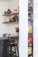 Integrated sliding pantry cabinet and breakfast bar