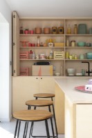Modern ply kitchen with colourful accessories