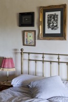 Country bedroom detail with brass bed