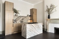 Contemporary kitchen with marble island.