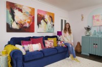 Woman in colourful living room.