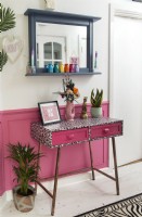 Console table in colourful hallway