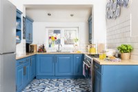 Blue and white upcycled kitchen with patterned tiled floor