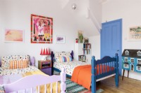 Twin beds in a colourful childrens bedroom
