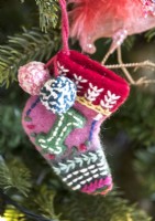 Detail of knitted Christmas stocking tree decoration 
