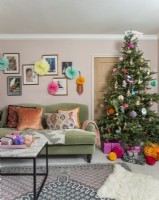 Colourfully decorated Christmas tree in living room
