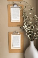 Extract pages of text displayed on wall mounted clipboards - detail
