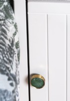 Gold and green door handle detail