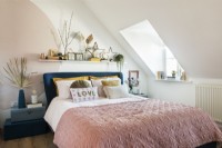Attic bedroom with pink bedding
