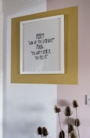 Framed quote on colourful wall - artwork detail