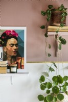 Detail of houseplants and painting of Frida Kahlo 