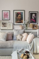 Display of colourful modern artwork on wall of living room