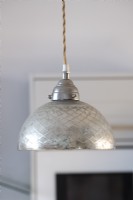 Detail of silver pendant light