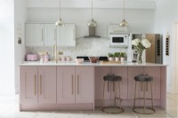 Modern pink and white kitchen with gold handles