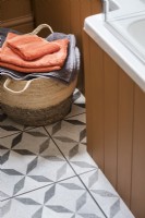 Detail of towels in a basket in modern bathroom