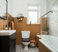Modern bathroom with split painted mustard brown walls