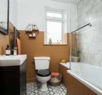 Modern bathroom with mustard brown painted walls