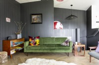 Green sofa in grey modern living room