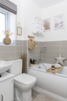 Compact modern bathroom with grey tiled splashback