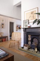 Victorian fireplace and contemporary rattan chair