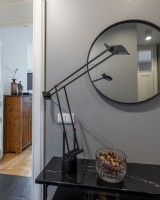 Table standing in the hall with lamp and mirror
