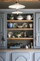 Grey painted wooden dresser with vintage crockery and accessories
