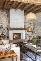 Lit fire in cosy country living room