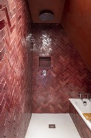 Burgundy tiling in wet room bathroom 