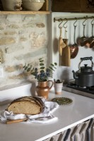 Bread on worktop in rustic country kitchen - detail 