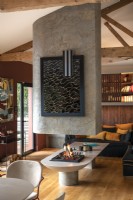 Lit central feature fireplace in contemporary living space
