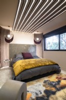 Contemporary bedroom with modern lighting design