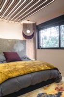 Contemporary bedroom with unusual lighting design