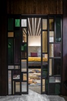 Sliding stained glass modern internal doors to contemporary bedroom