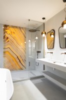 Decorative marbled glass panel in shower cubicle in modern bathroom