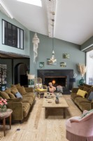 Eclectic living room with large fireplace at one end