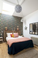 Floral wallpaper feature wall in modern bedroom