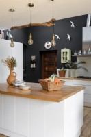 Black painted wall in modern kitchen