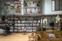Eclectic living room with large wall display of colourful skateboards