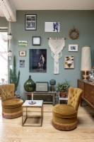 Eclectic living room filled with vintage furniture and artwork