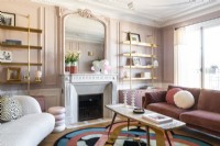 Pink painted walls and furnishings in modern living room