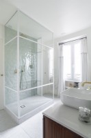 Shower cubicle in white classic style bathroom