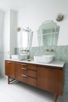 Vintage wooden vanity unit with twin sinks and retro mirrors