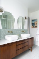 Retro bathroom with vintage vanity unit and twin sinks