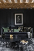 Black painted paneled walls in modern country living room