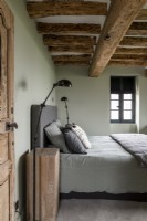 Modern country bedroom with pale green painted walls