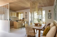 Open plan kitchen-diner in modern wooden cabin