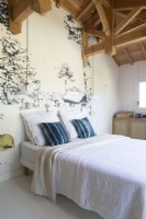 Mural feature wall in white country bedroom